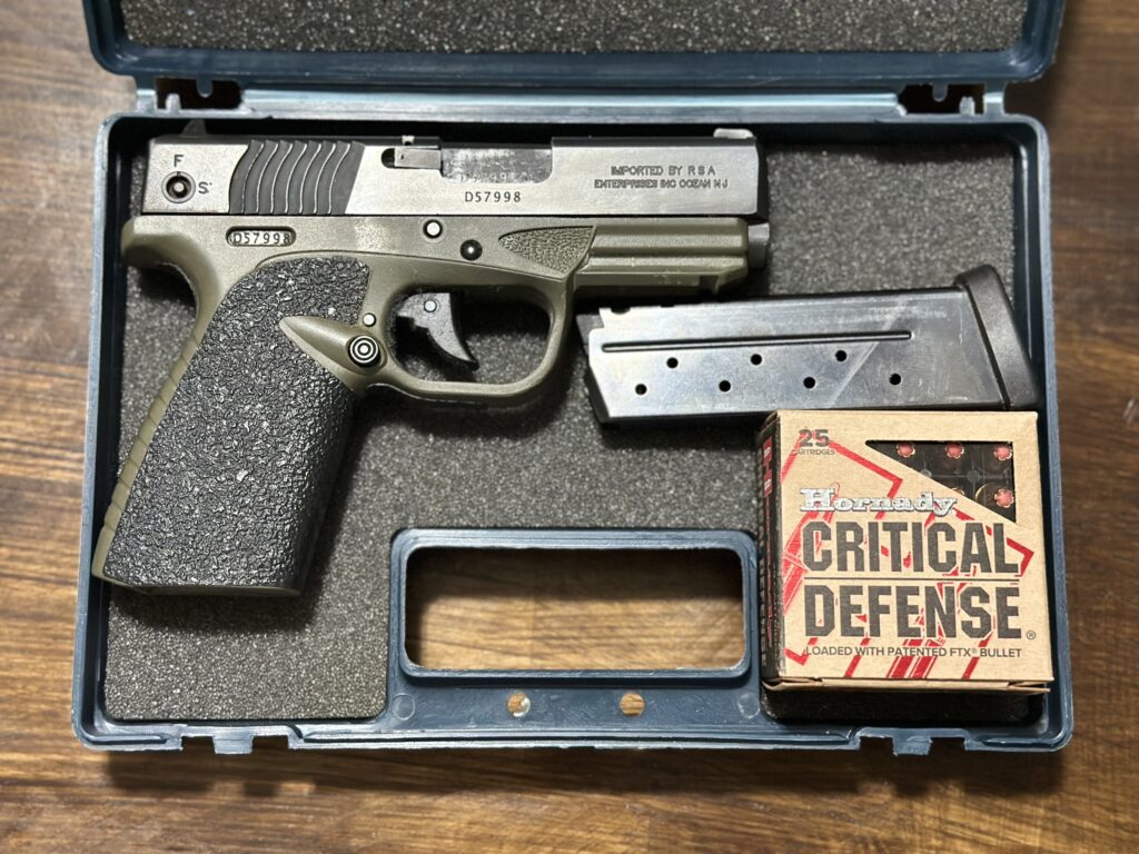 pistol in a case with a magazine and ammo box ready for the airport