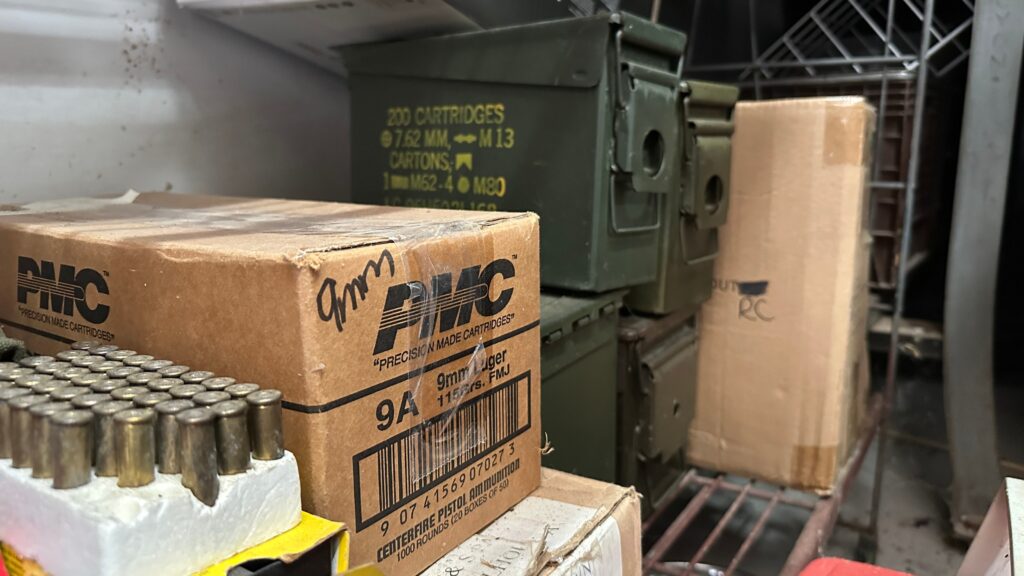 bulk ammo on shelf in garage