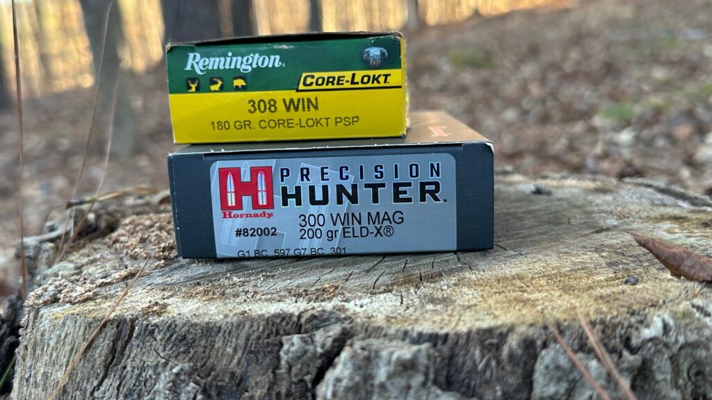 two ammo boxes on a tree stump
