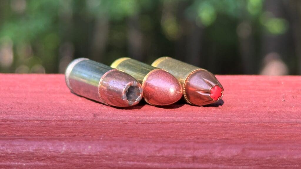 Nine-millimeter bullets of different designs laying next to each other.