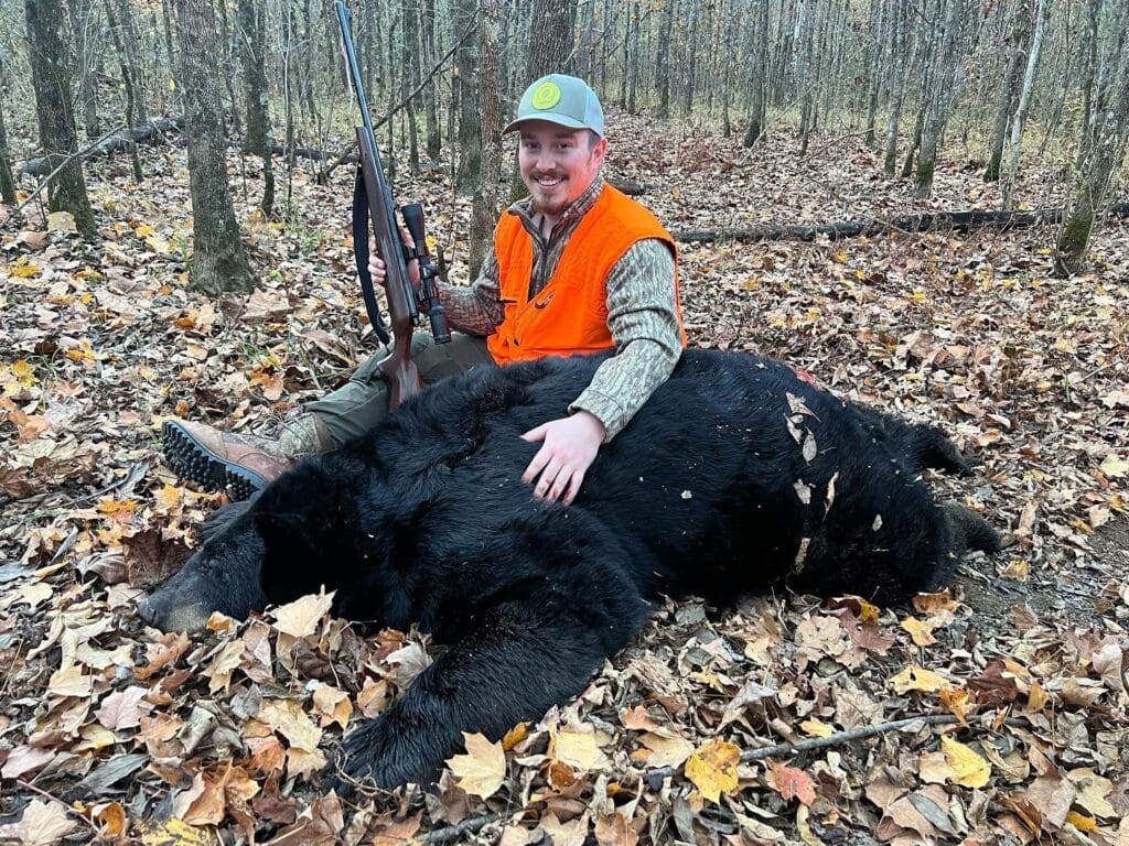 Patrick Long with a black bear